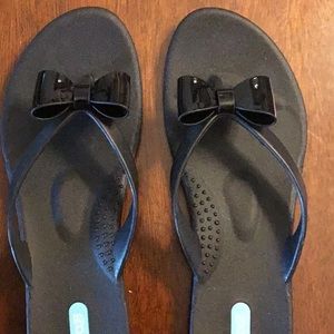 Oka B black bow patent flip flops